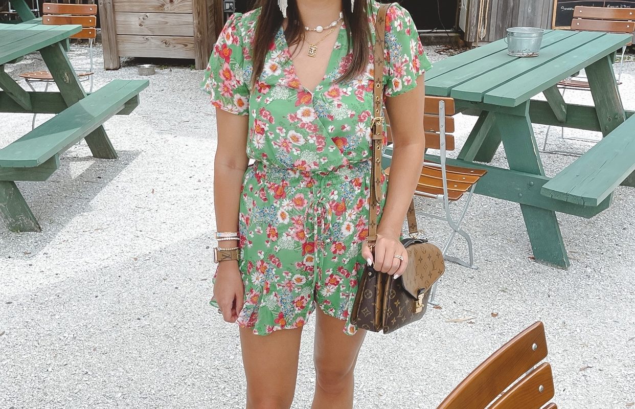 sugarlips green floral romper with white hat and louis vuitton pochette metis