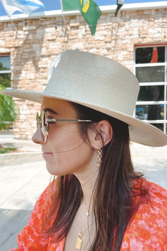 kendra scott hoops with gucci sunglasses and brixton hat