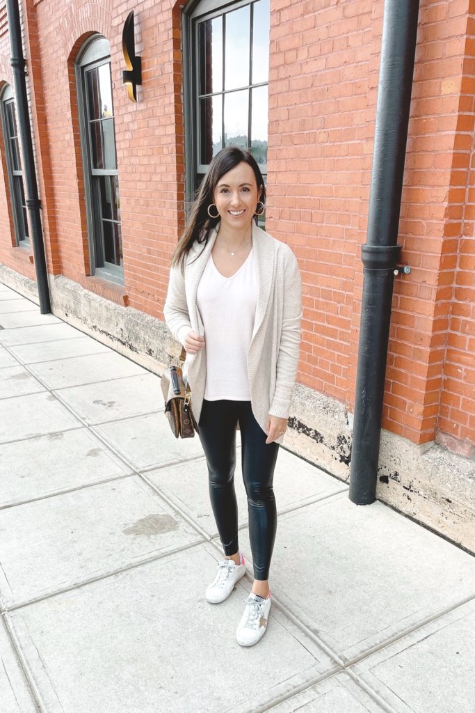 barefoot dreams circle cardigan with commano faux leather leggings and golden goose sneakers