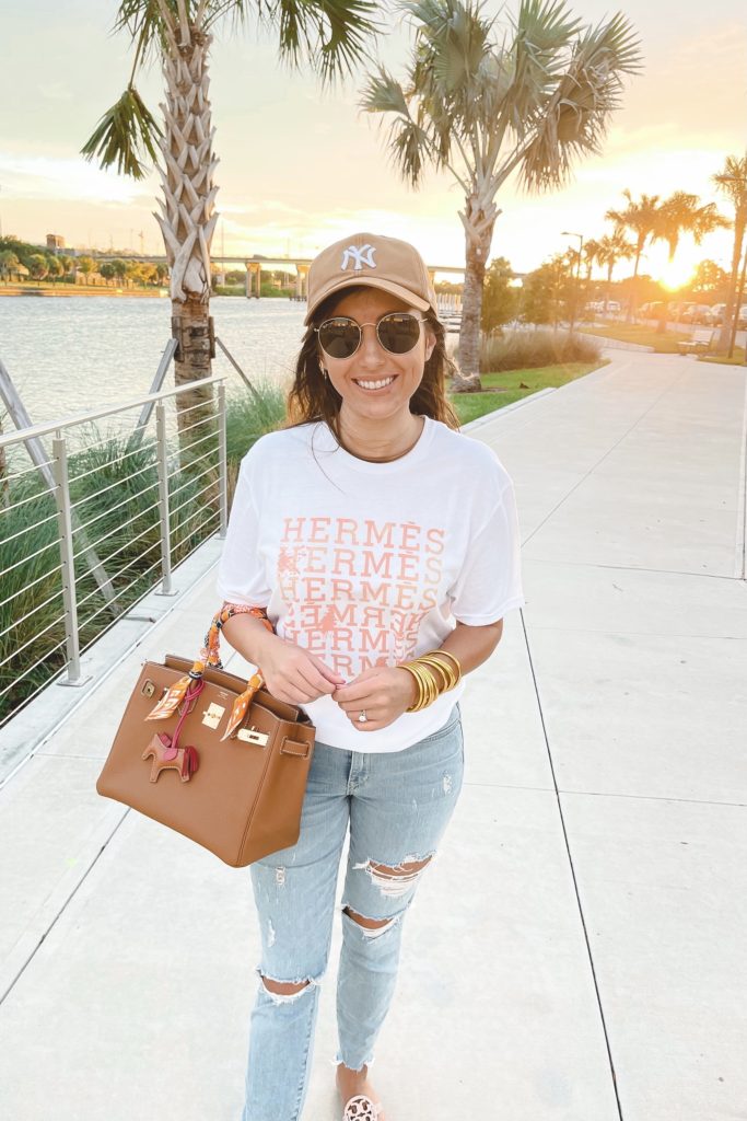 hermes tee with gold birkin and ripped jeans