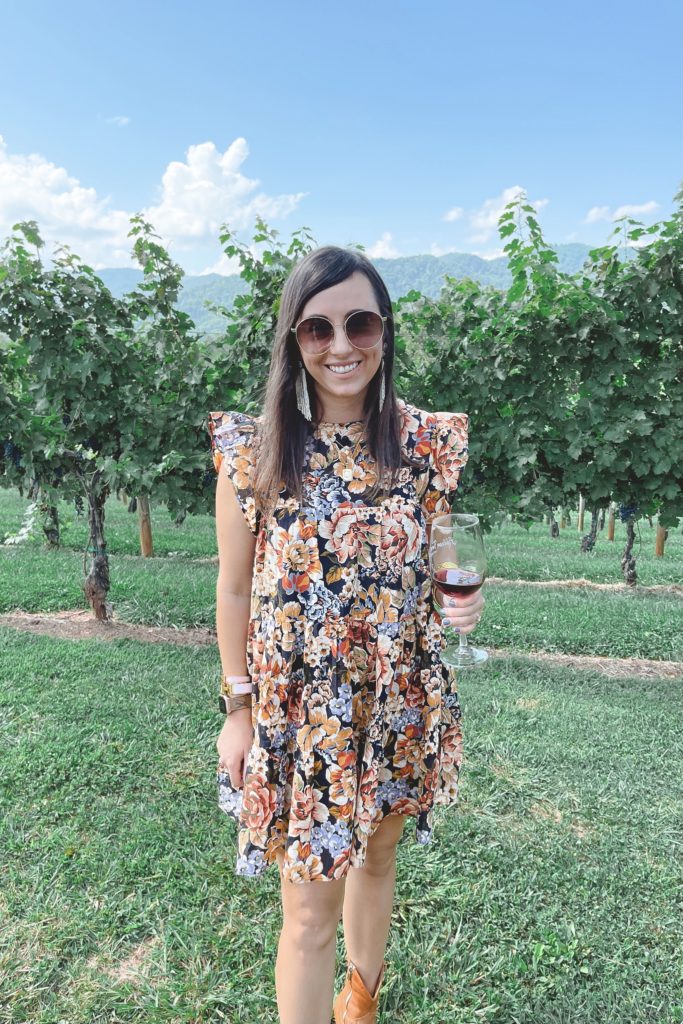 floral dress with cowgirl boots at addison farms vineyard