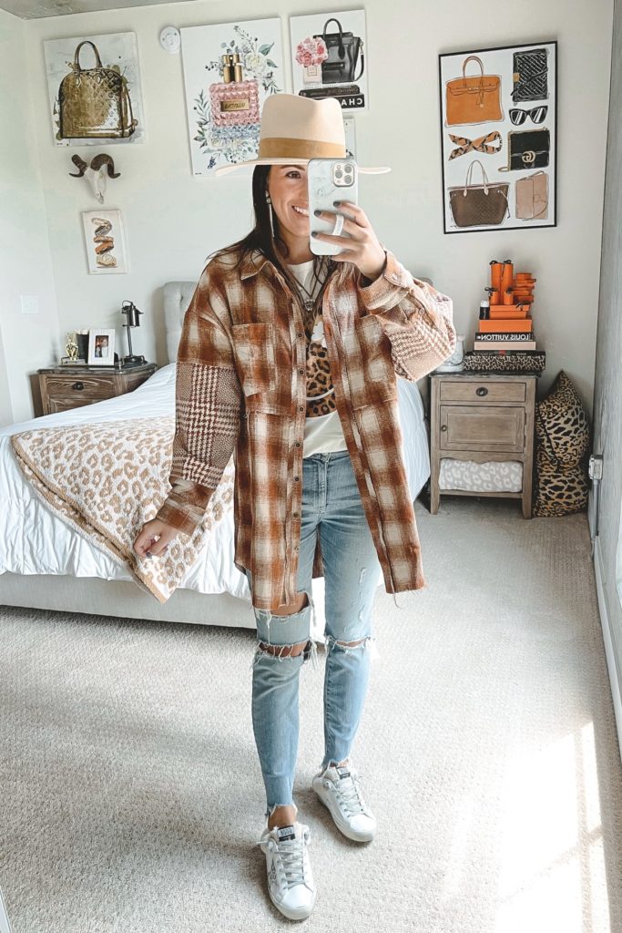 rust plaid shacket with skinny jeans and golden goose sneakers