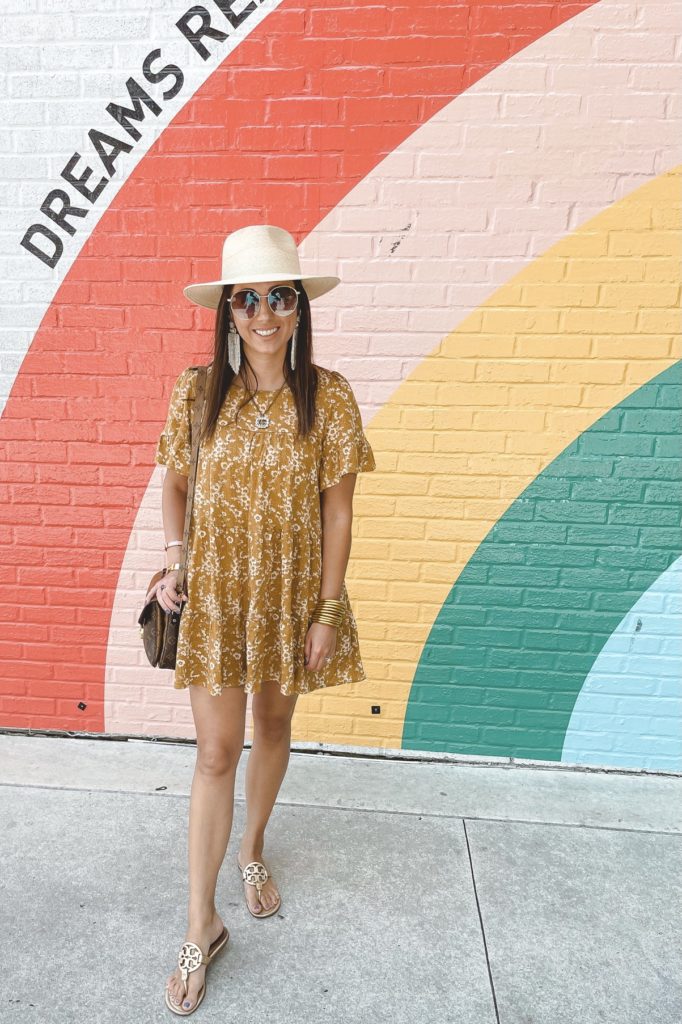 mustard floral dress with tory burch miller sandals and brixton hat