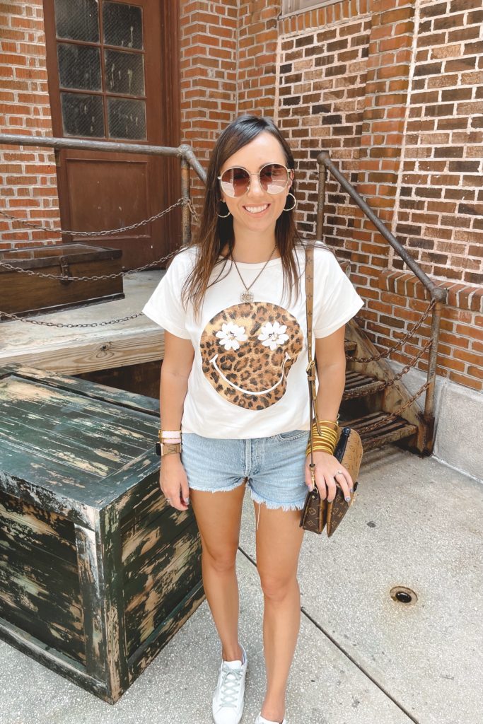 leopard smiley tee with agolde denim shorts and budhagirl bracelets