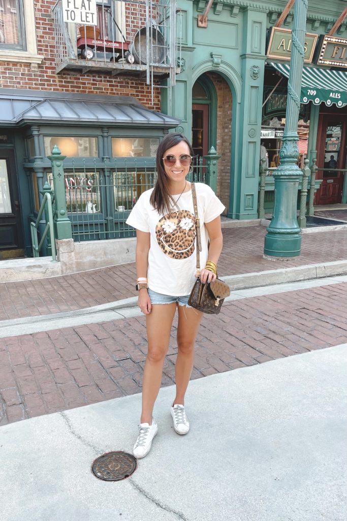 leopard smiley tee with agolde denim shorts and golden goose sneakers