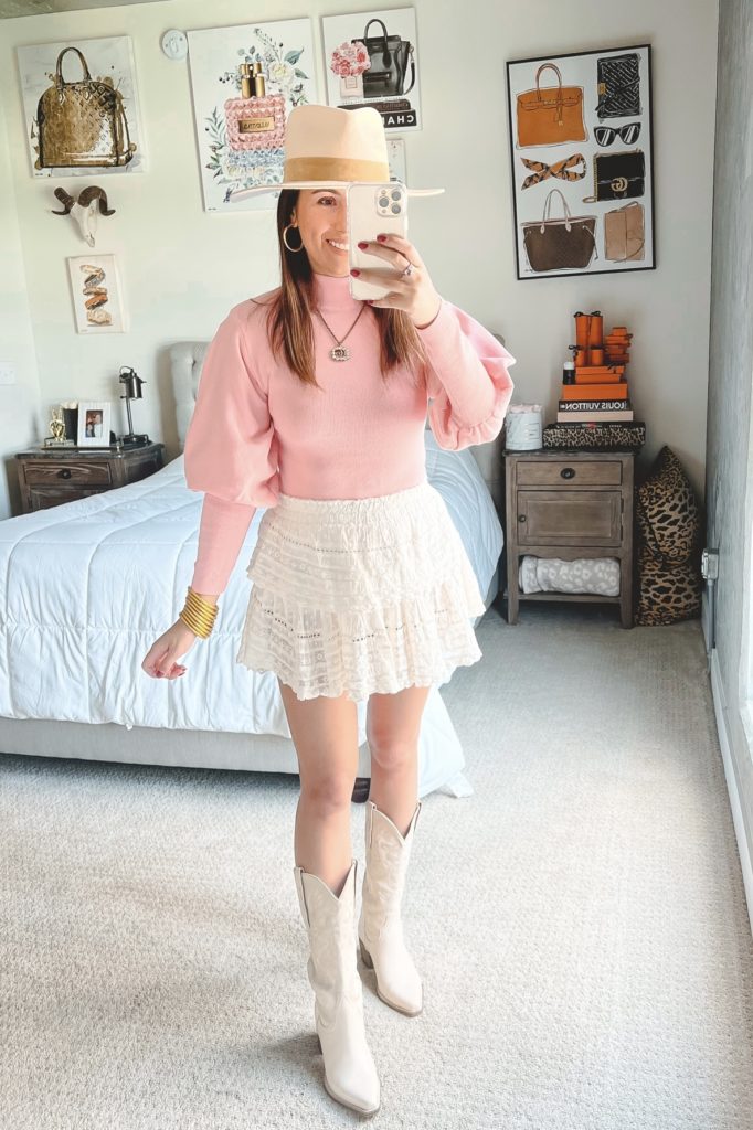 amazon pink sweater with loveshackfancy skirt and cowgirl boots