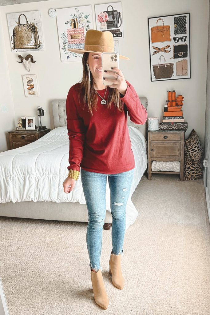 amazon burgundy top with lack of color hat and skinny jeans