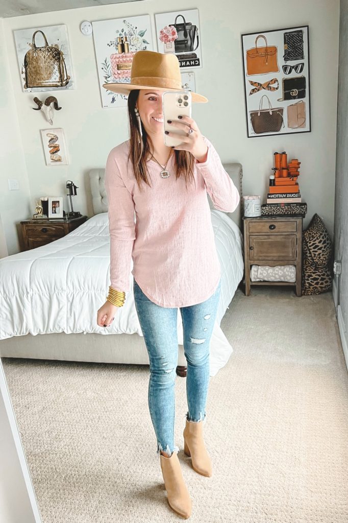 amazon pink long sleeve top with lack of color hat and skinny jeans