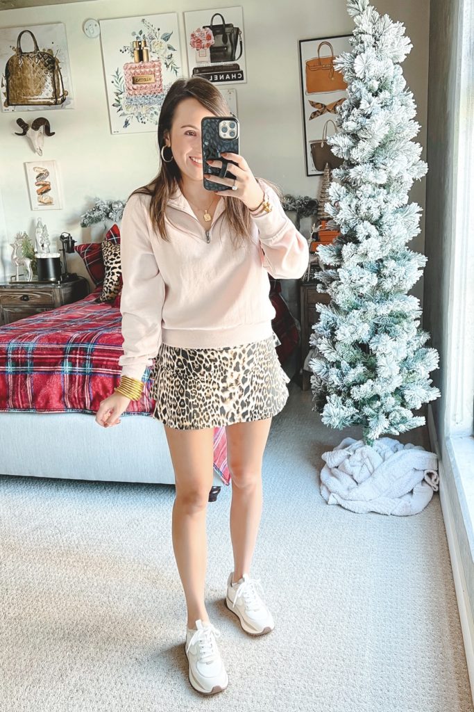 dona jo leopard skort with pink half zip and sneakers