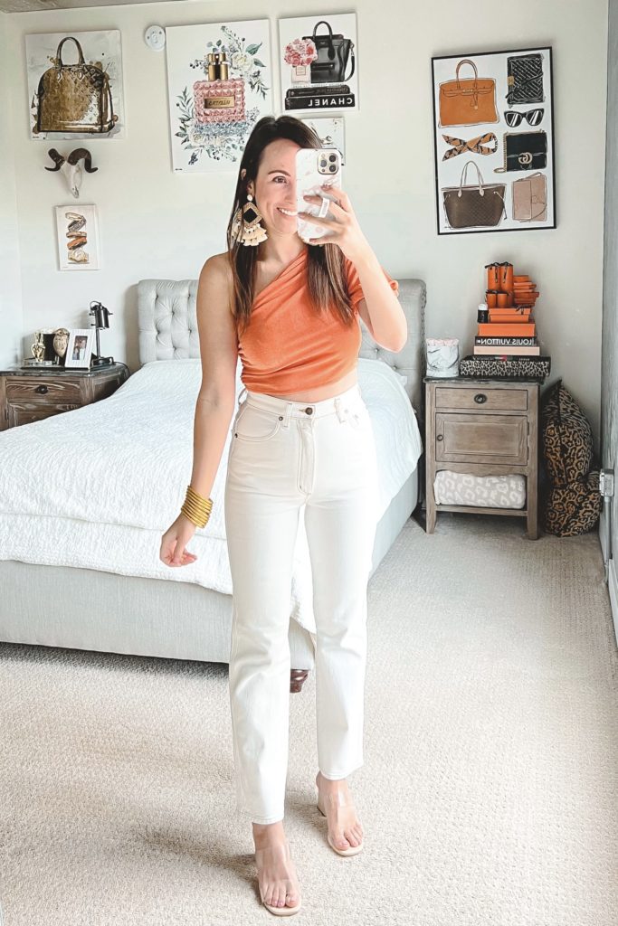 amazon orange crop top with white denim and heels