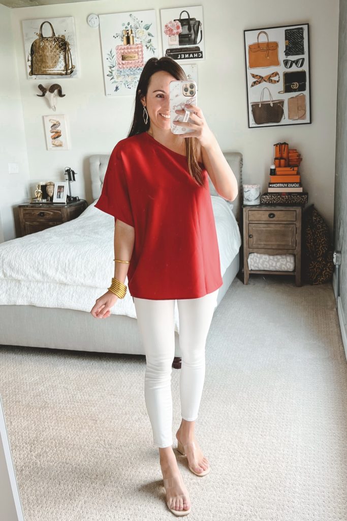 amazon red one shoulder top with white jeans and heels