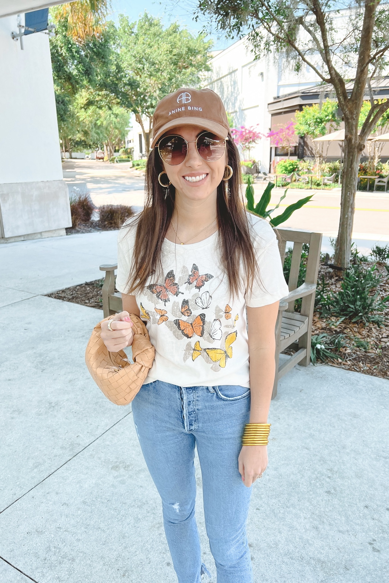 chaser butterfly tee with agolde jeans and anine bing cap