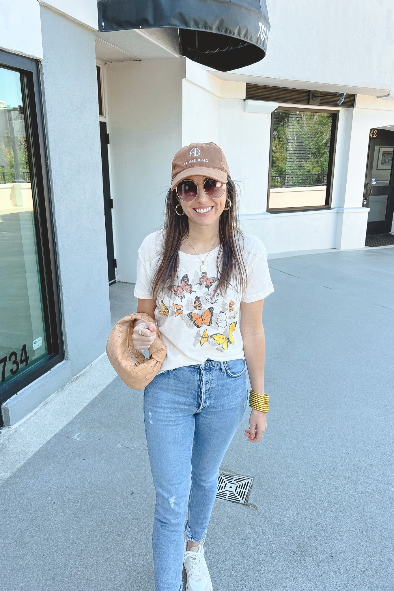 chaser butterfly tee with agolde jeans and bottega veneta mini jodie dupe