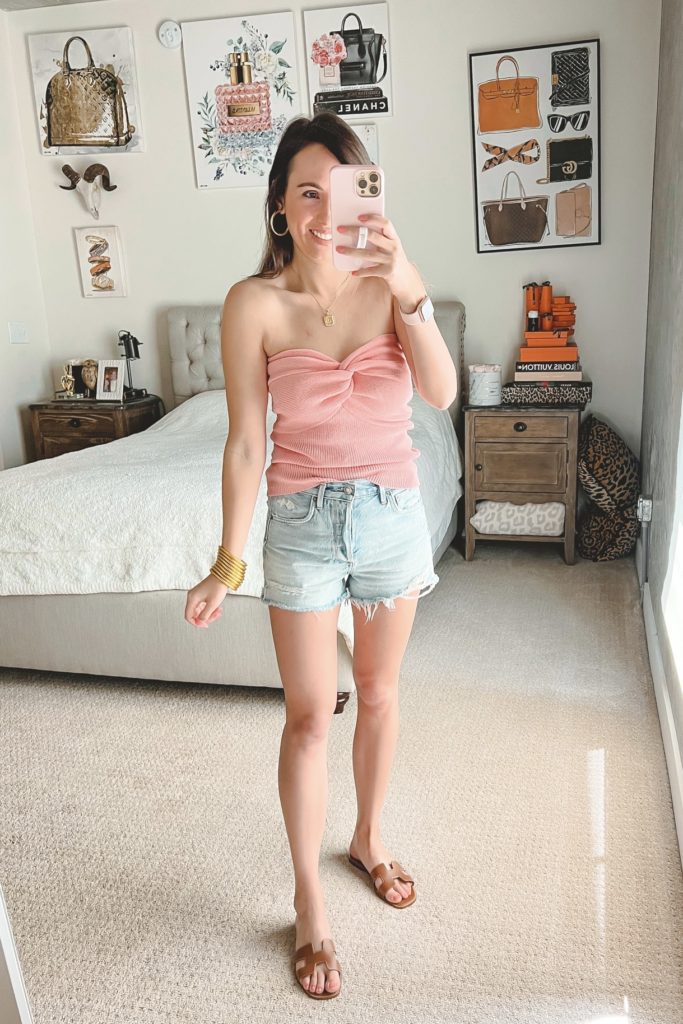 amazon pink tube top with agolde denim shorts and hermes oran sandals