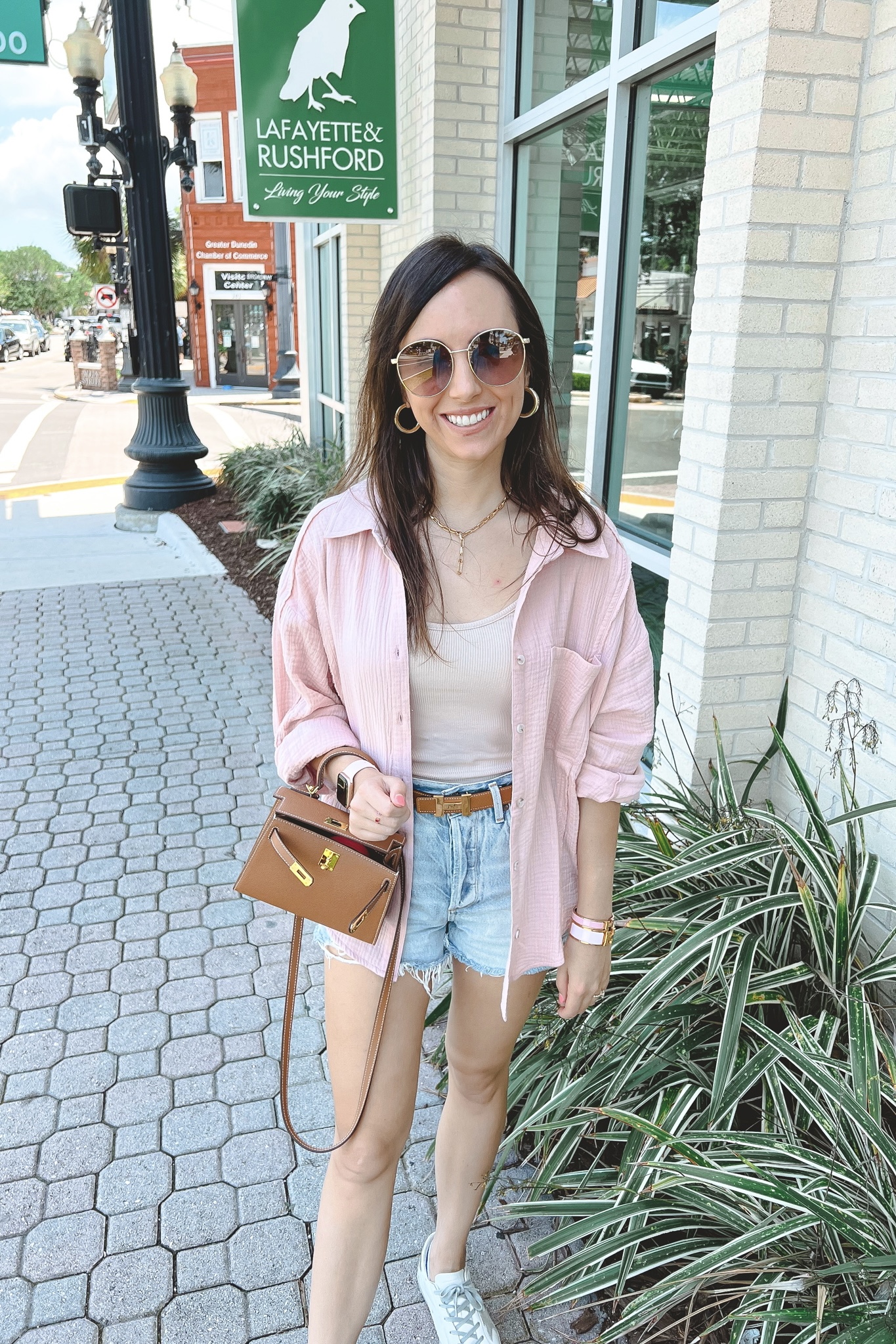 pink button down with hermes belt and mini kelly dupe