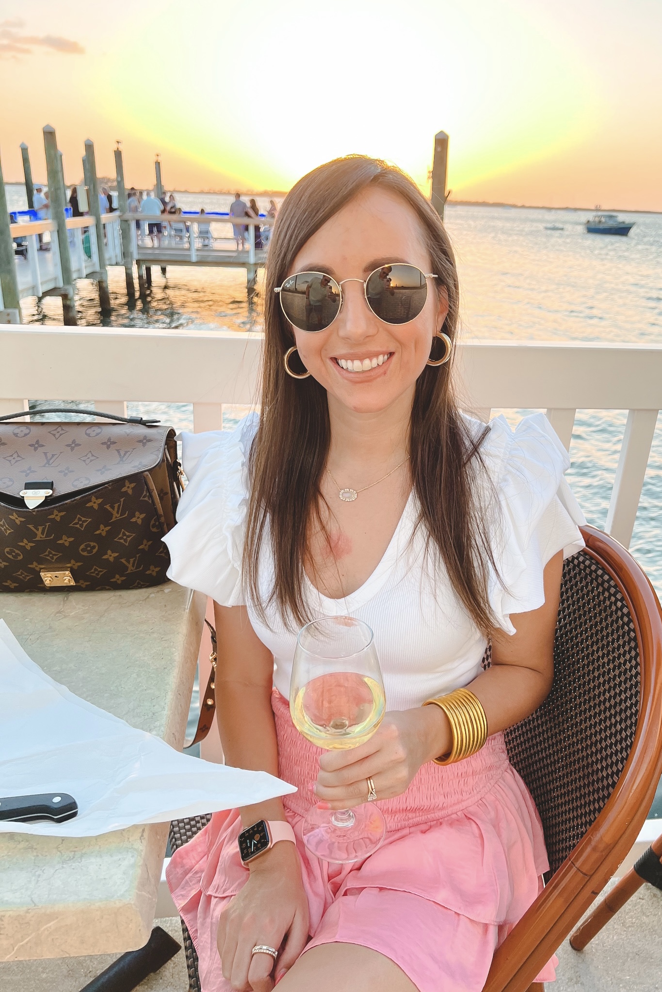 feeling flirty pink skort with express bodysuit and rayban icon sunglasses