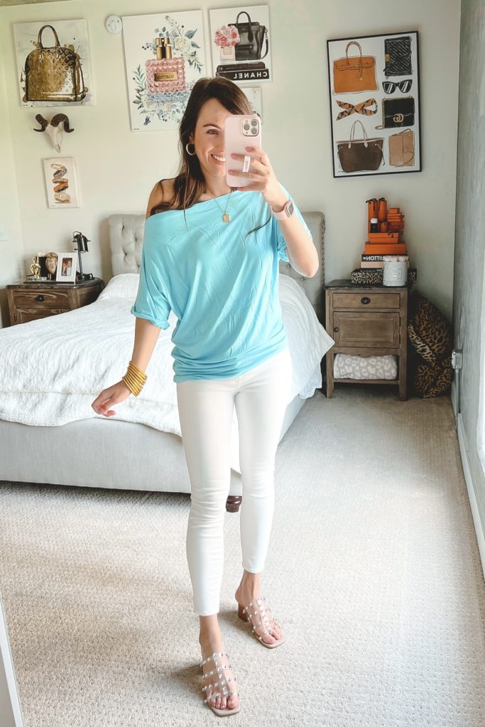 amazon blue off the shoulder tee with white jeans and clear stud sandals