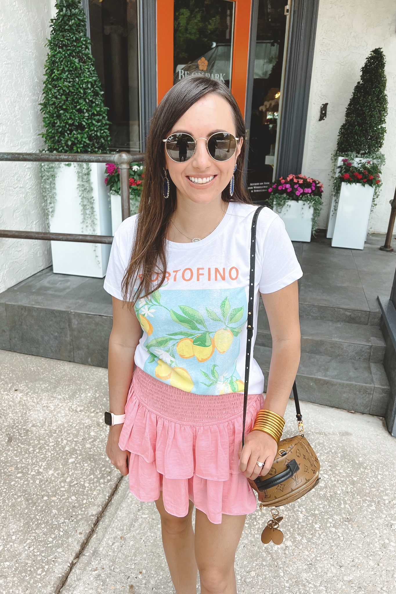 chaser portofino tee with pink skort and louis vuitton palm springs mini