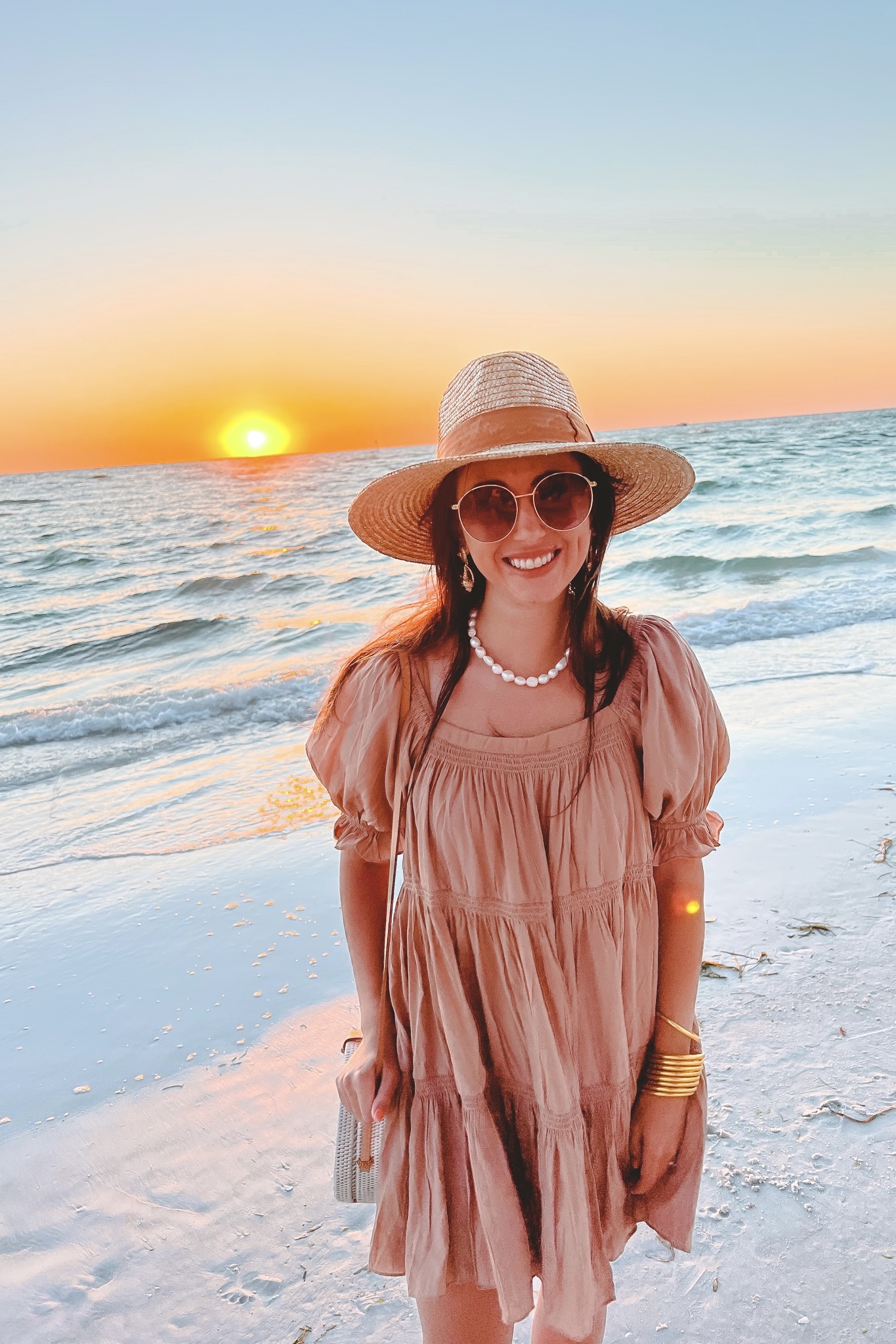 mocha romper with pearl necklace and brixton hat