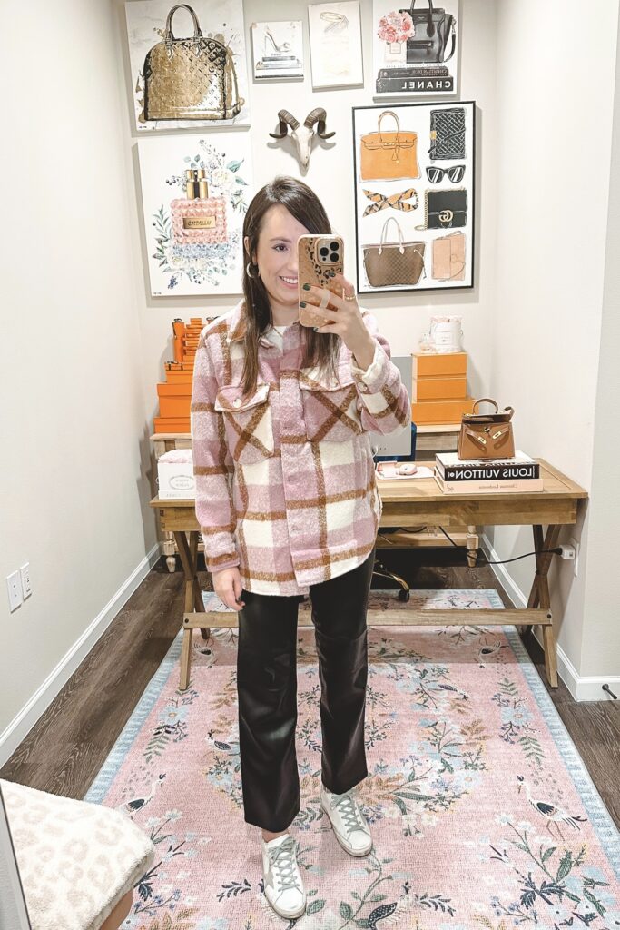 blanknyc pink plaid shacket with black faux leather pants and golden goose sneakers