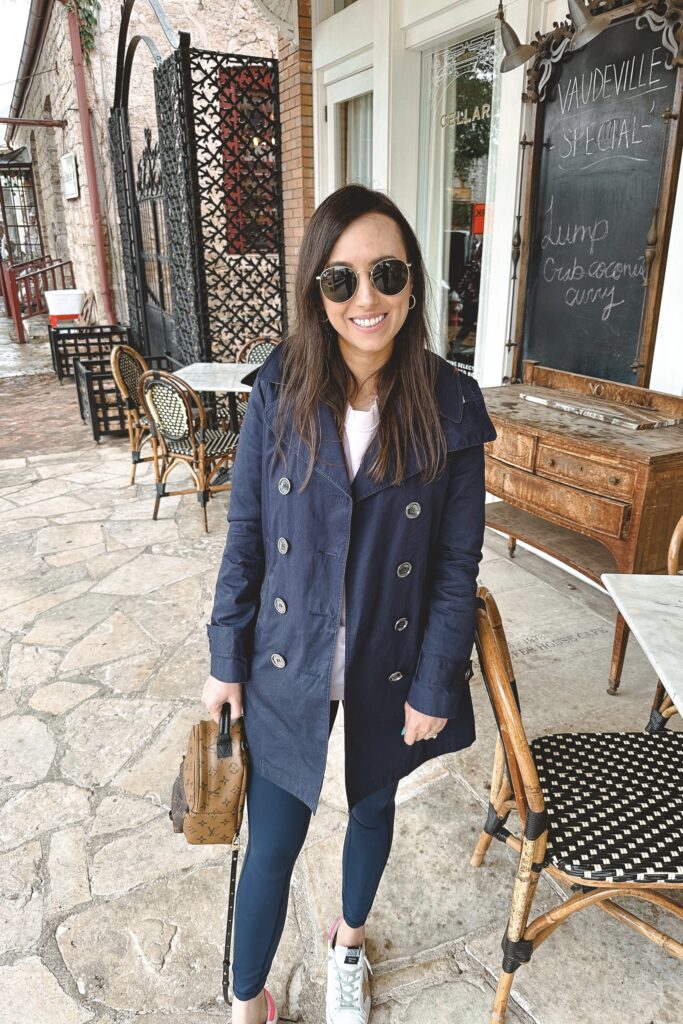 Burberry navy trench with lululemon navy leggings and golden goose sneakers