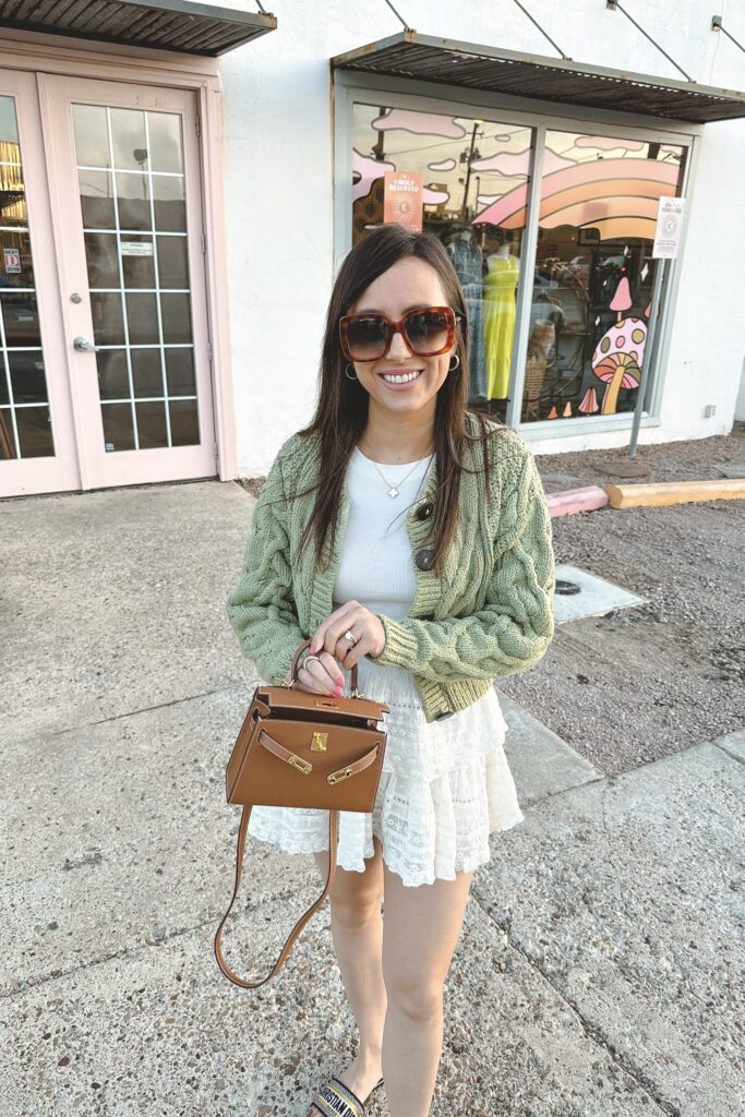free people bonfire cardigan green with loveshackfancy ivory ruffle skirt and hermes mini kelly dupe