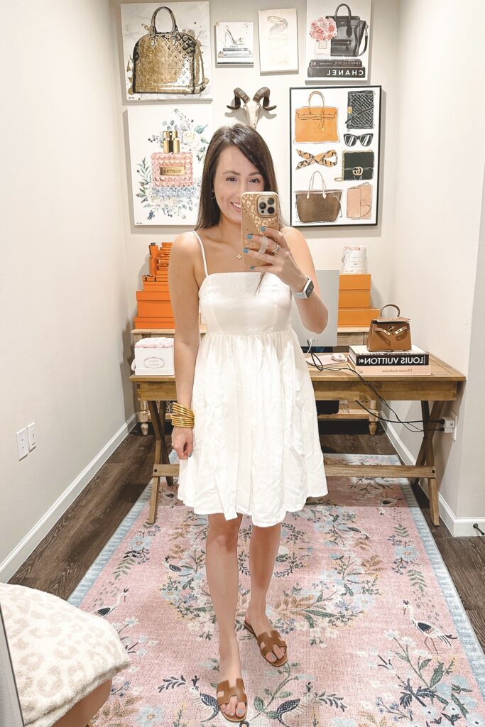 Aura white linen mini dress with hermes oran sandals