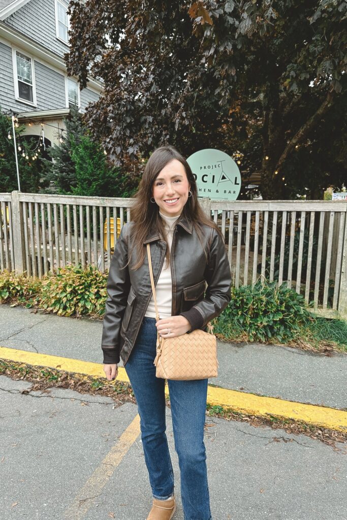 Brown leather bomber jacket with agolde jeans and ugg ultra mini boots