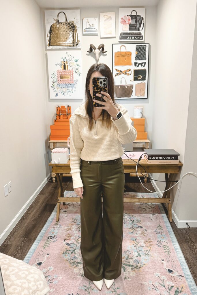 Olive faux leather wide leg pants with quarter zip cream sweater and white booties