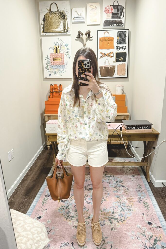 Floral spring ivory blouse with white agolde parker shorts and raffia wedge sneakers