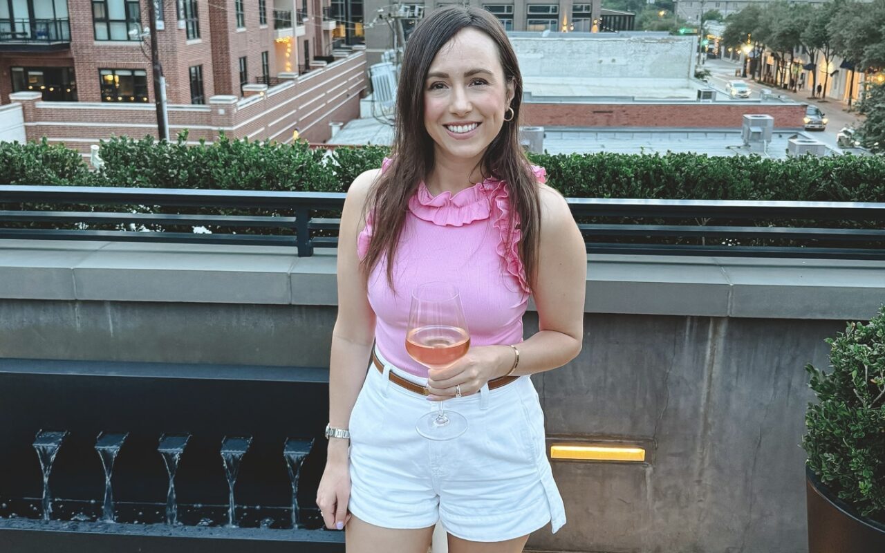 Amazon ruffle pink sleeveless bodysuit with white denim shorts and hermes gold oran sandals