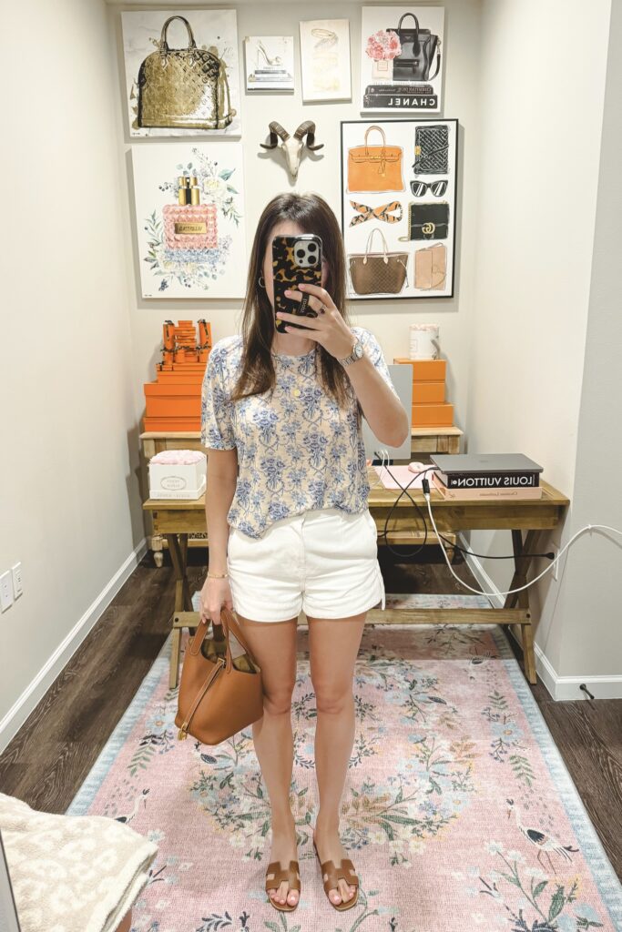 Loveshackfancy calix tee with white denim shorts and hermes gold picotin