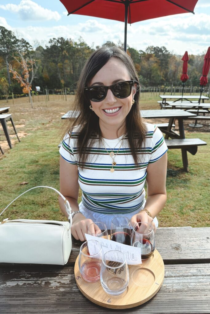 Zara stripe baby tee with rayban wayfarer sunglasses and the row ivory 90s bag