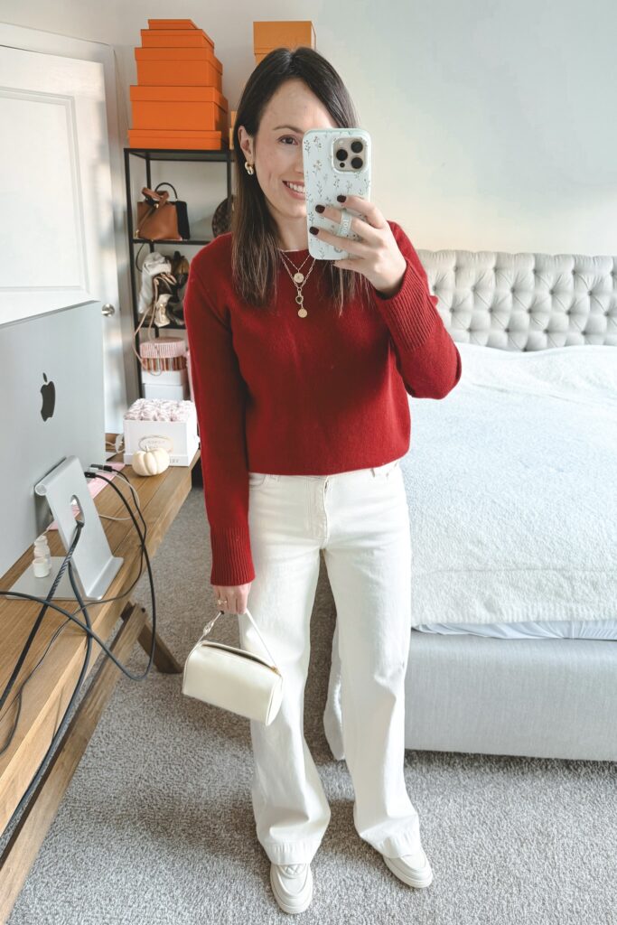 Vince red sweater with ecru baggy jeans and white chanel loafers