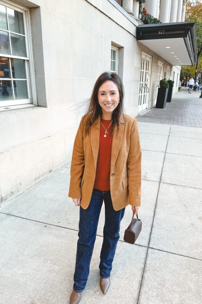 Camel suede blazer with red sweater and dark denim