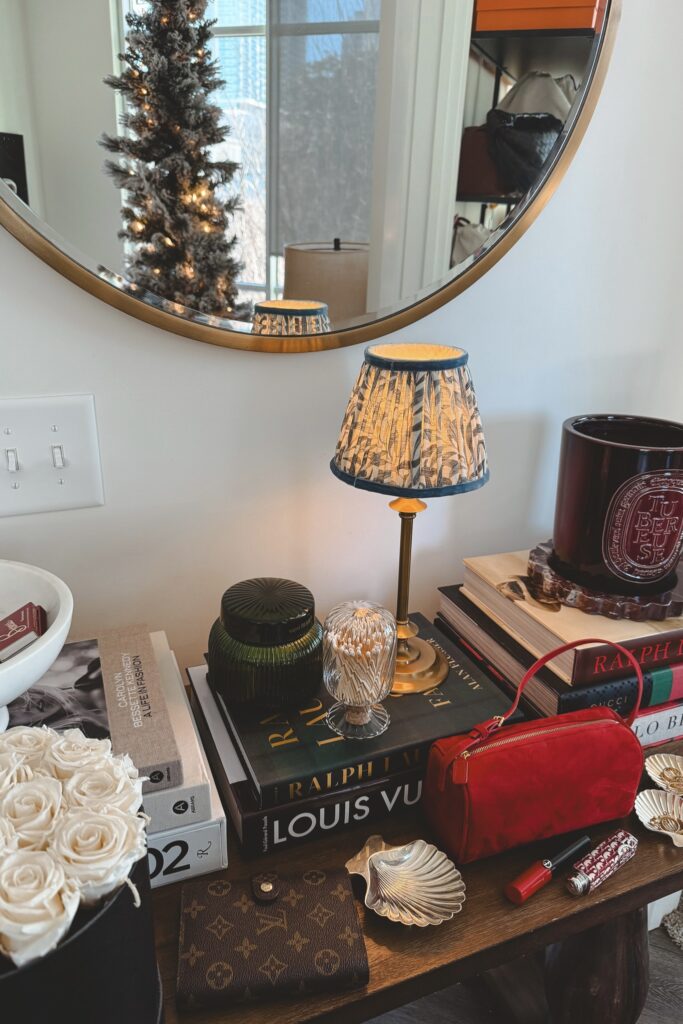 Console table with pooky lamp and red the row 90s bag