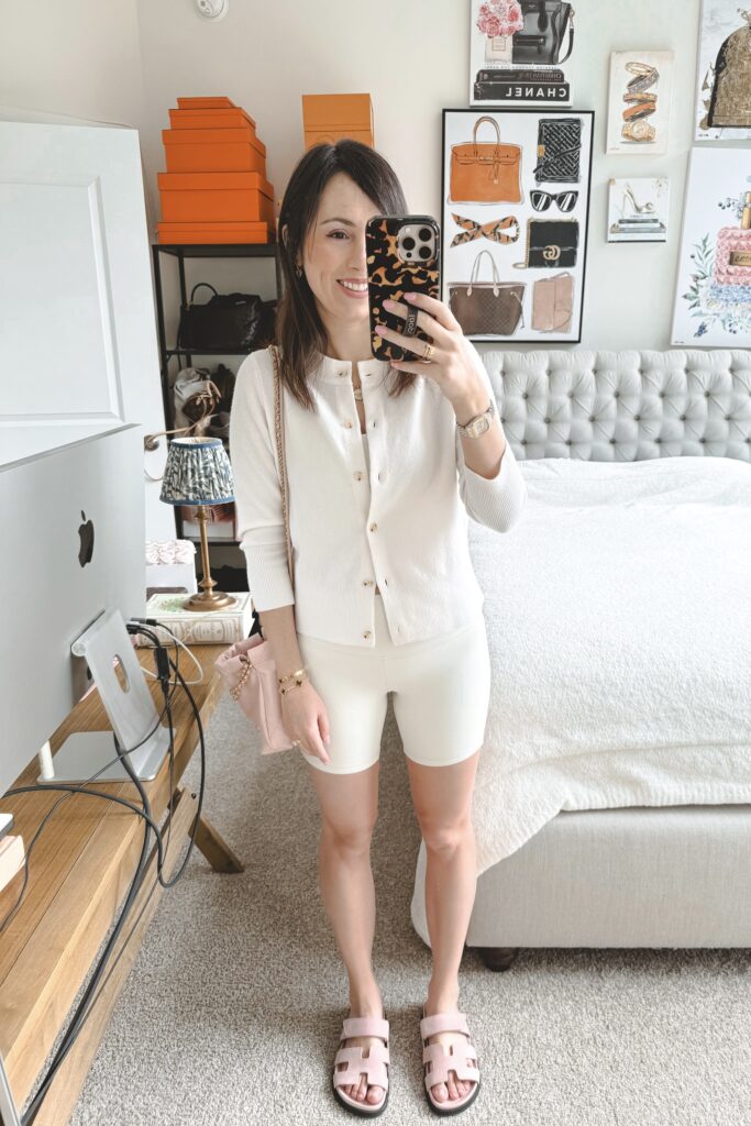 Vince white cardigan with lululemon bone align shorts and pink chanel 22 mini
