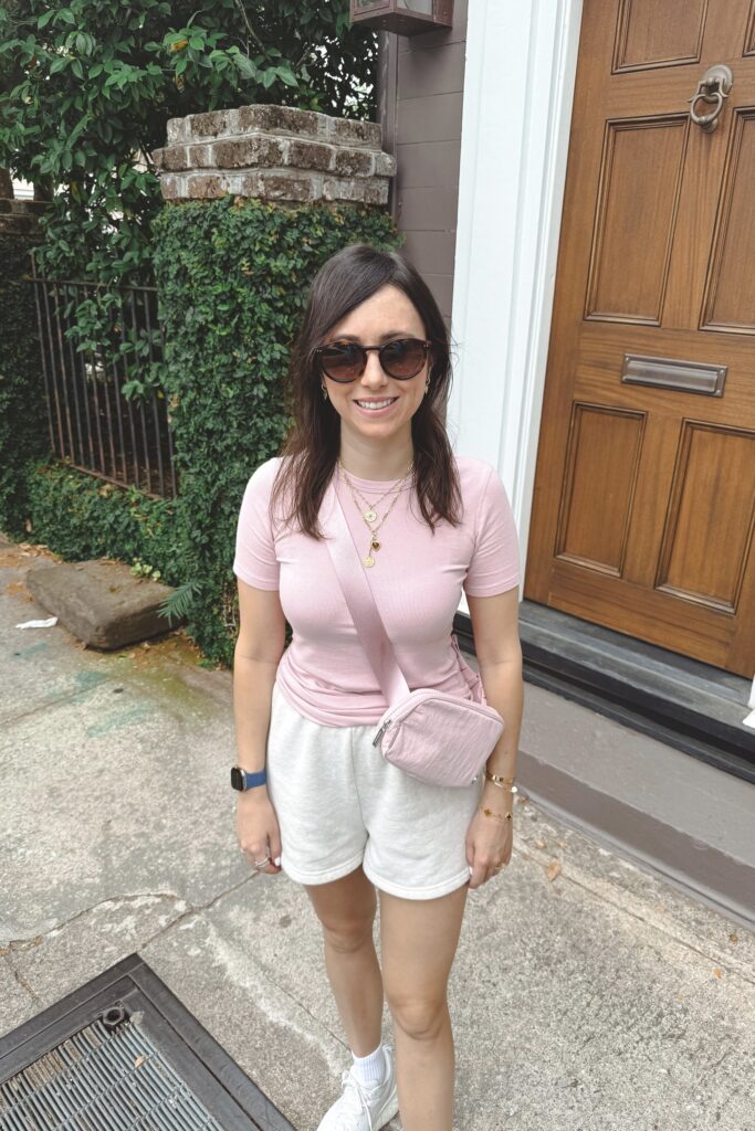 Lululemon hold tight tee pink haze with aritzia oatmeal fleece shorts and lululemon belt bag pink haze