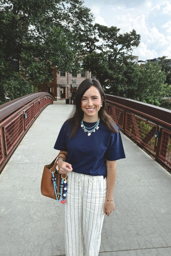 J crew navy boxy tshirt with stripe linen pants and hermes gold picotin