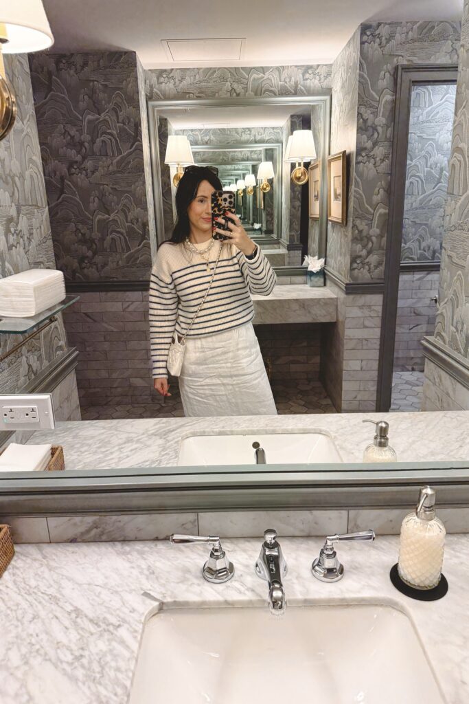 Tanya Taylor Fleur stripe sweater over white linen dress and white chanel 31 bag