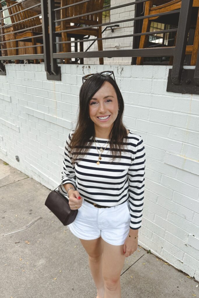 J crew stripe mariner tee with white denim shorts and brown the row 90s bag