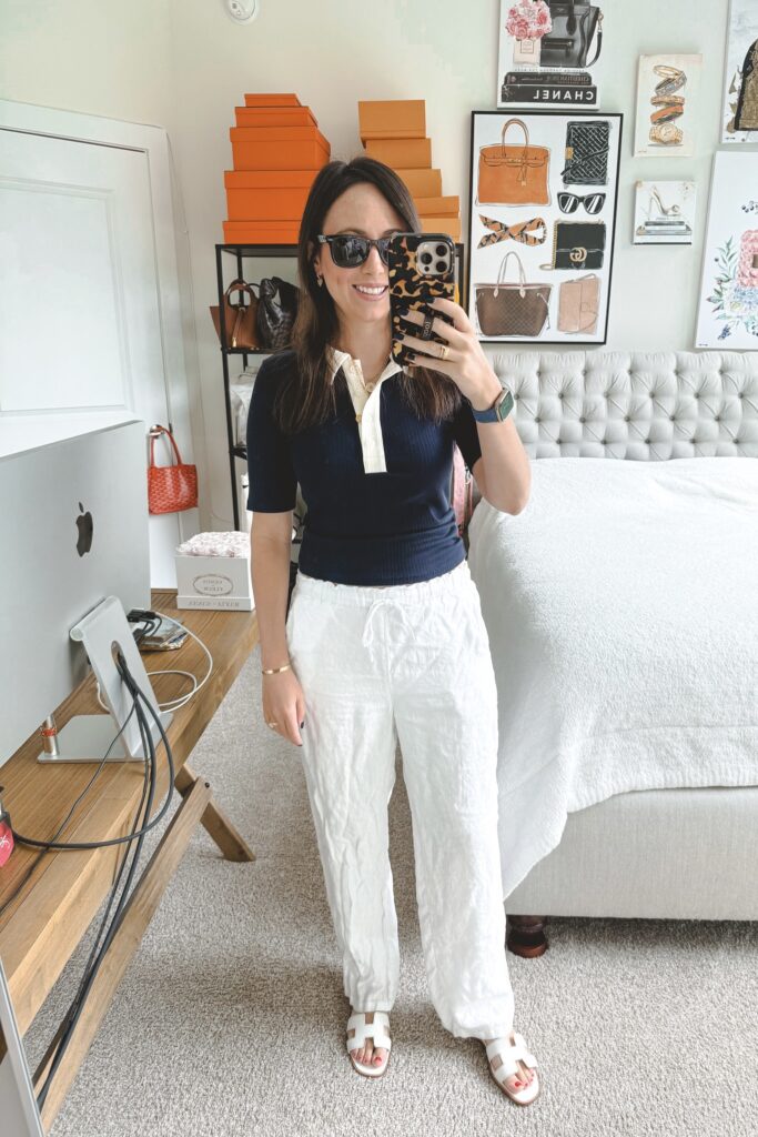 J crew navy ribbed polo with white linen pants and white hermes oran sandals
